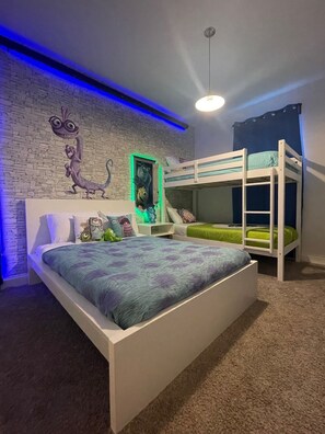 A bedroom with a bunk bed, a brick wall, and a mural.