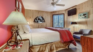 A bedroom with a bed, a ceiling fan, a TV, and a window with blinds. - Westwind 102 2BD 2BA Diamond Condo in Lionshead Village (Vail)