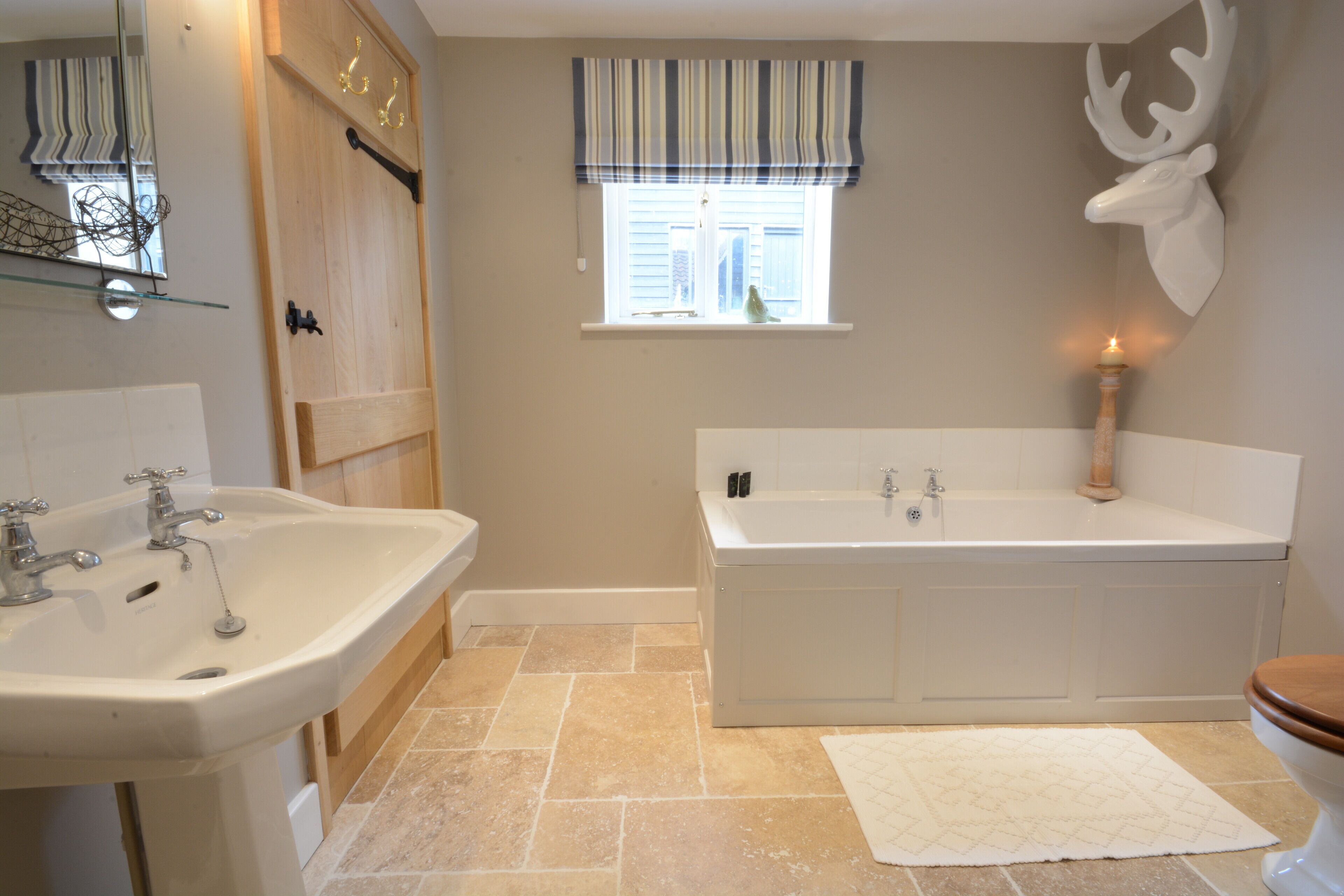 A bathroom with a sink, bathtub, and toilet.