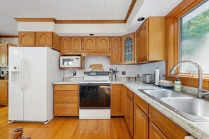 Fridge, microwave, oven, stovetop - Secluded waterfront home with private dock, outdoor dining, firepit, WiFi & W/D (Orland)