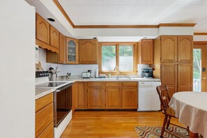 Fridge, microwave, oven, stovetop - Secluded waterfront home with private dock, outdoor dining, firepit, WiFi & W/D (Orland)