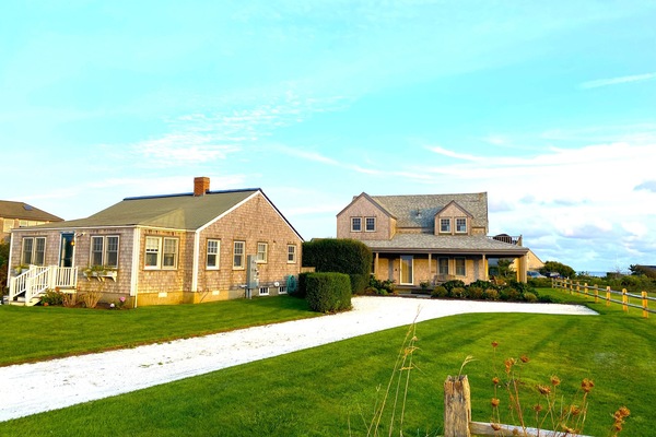 Cottage on left; bunk house in middle/background; main house on right