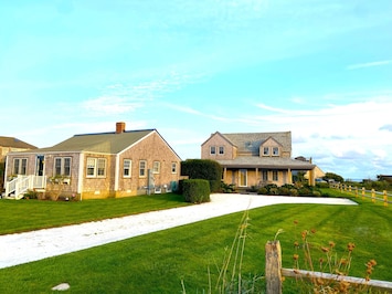 Cottage on left; bunk house in middle/background; main house on right