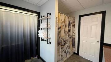 Combined shower/tub, hair dryer, towels, soap