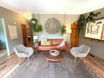 Our living space is super cozy & bright with windows overlooking the State Park!