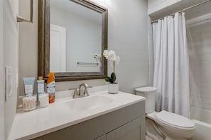 Combined shower/bathtub, hair dryer, towels, soap