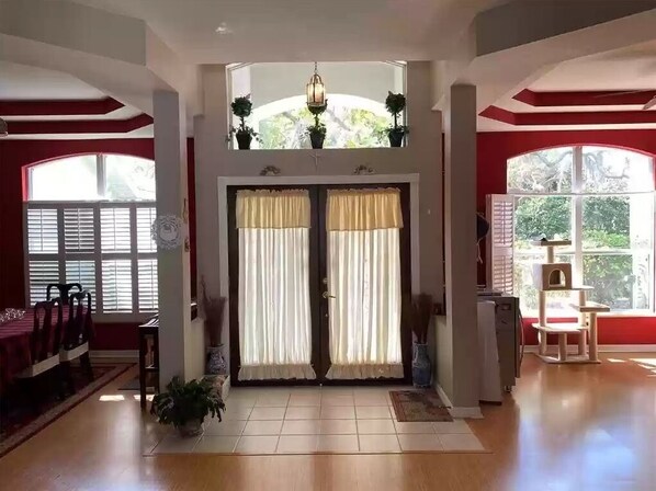 Relax in this stylish room with a dining table, seating area, and outdoor access.