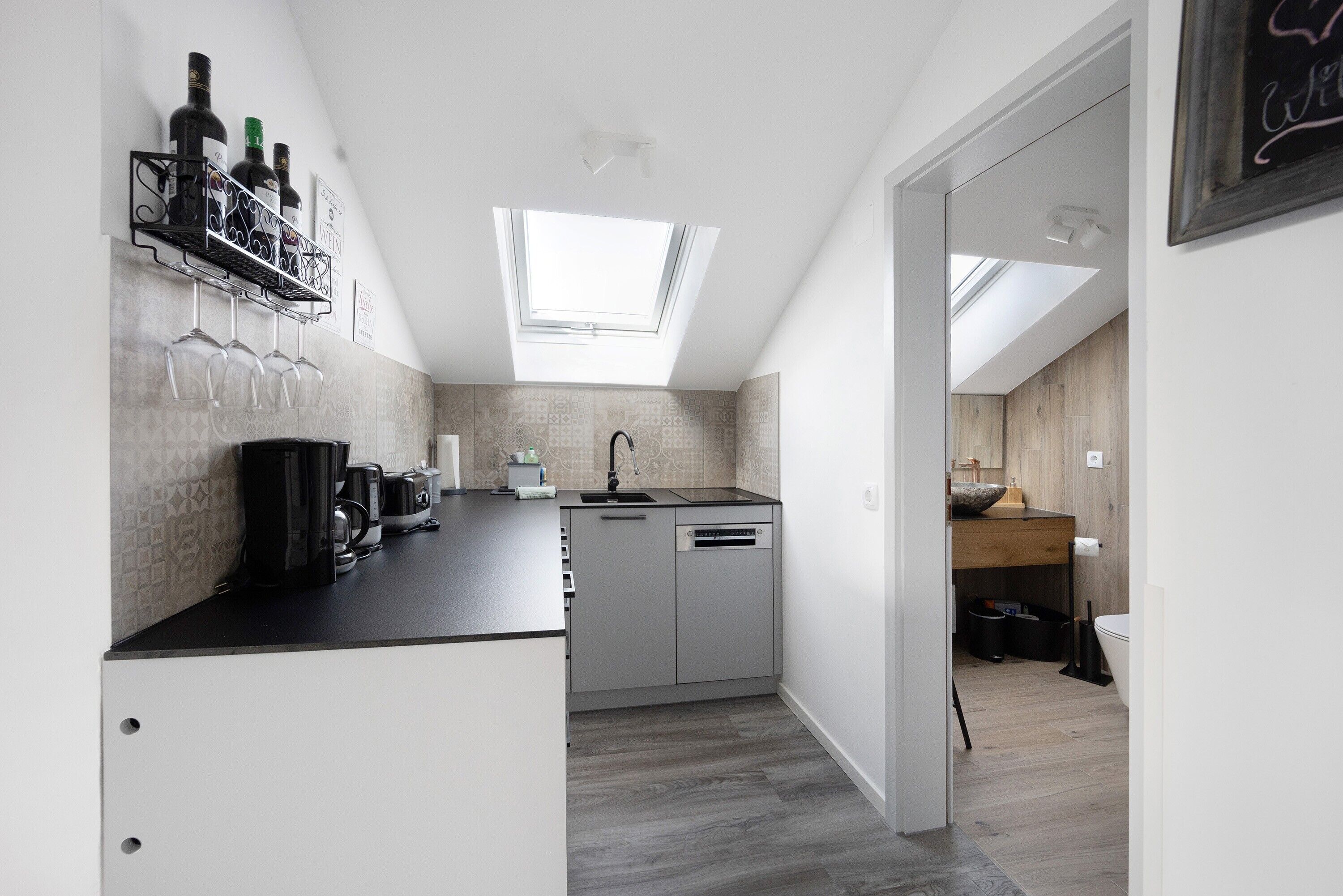 Fridge, stovetop, dishwasher, coffee/tea maker