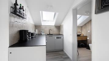 Fridge, stovetop, dishwasher, coffee/tea maker