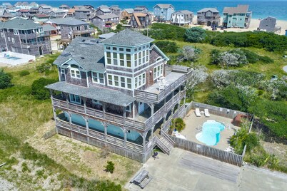 Towering beach house with private pool, hot tub, decks & ocean views