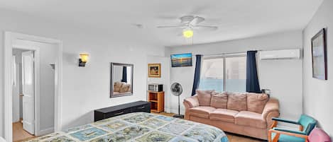 Studio Suite | Living area | TV, smart speakers