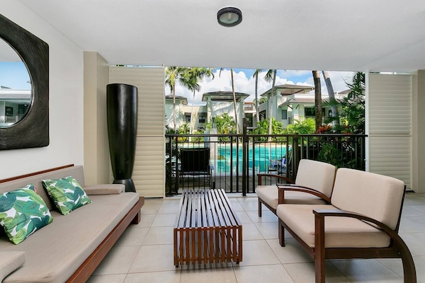 Relax and unwind on the balcony while soaking in pool and garden views with your group.