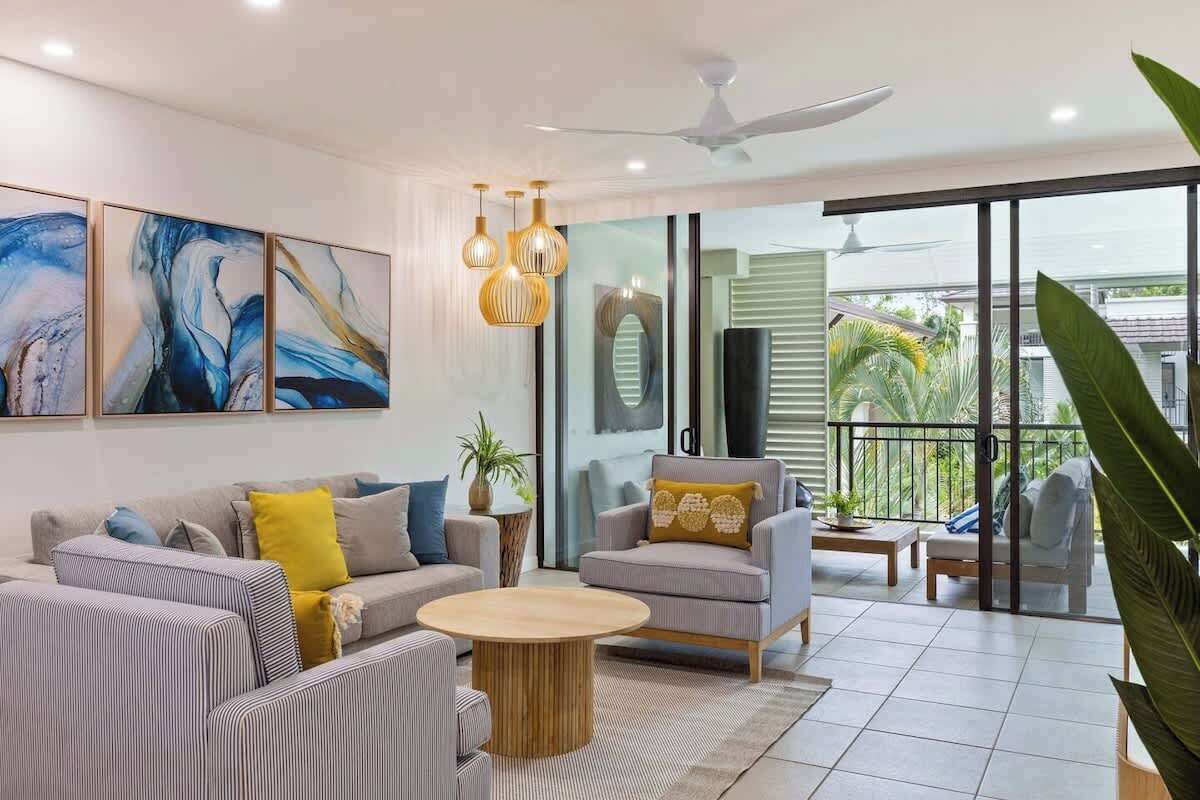 Relax in a spacious living room equipped with both air-conditioning and a ceiling fan for utmost comfort. The sofa bed can be set up to sleep one child.