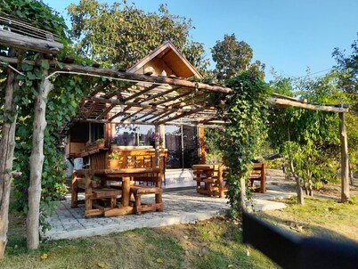 A Bungalow with attached kitchen in rural environment