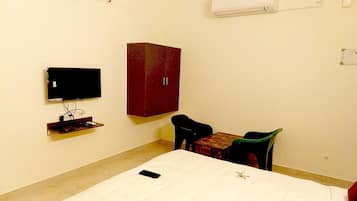 Deluxe Double Room | Living area | 20-inch Smart TV with cable channels, TV
