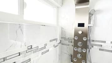 Combined shower/tub, hair dryer, towels, soap