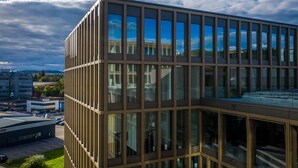 A modern building with a grid of windows and a flat roof. - Lumen Apartments (Schenkon)
