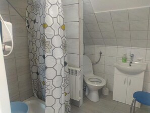 Bathtub, hair dryer, towels, soap