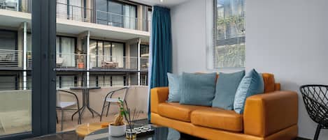 Deluxe Apartment | Living area | 48-inch flat-screen TV with cable channels, TV, Netflix