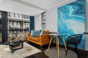Deluxe Apartment | Living area | 48-inch flat-screen TV with cable channels, TV, Netflix - Adderley Terraces K03 (Cape Town)