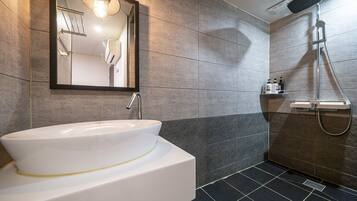 Separate bathtub and shower, free toiletries, hair dryer, bathrobes