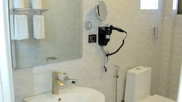 Hair dryer, slippers, towels, soap