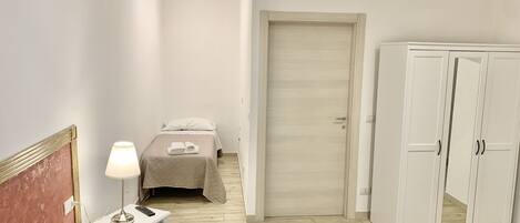 1 bedroom, desk, iron/ironing board, travel cot