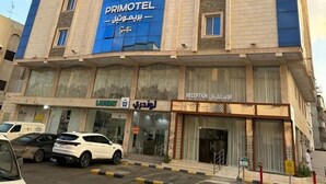 A multi-story building with a prominent blue facade and the name "PRIMOTEL" displayed. - PRIMOTEL Suites Al Salamah (Jeddah)