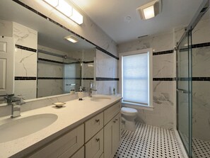 Combined shower/tub, hair dryer, towels, toilet paper