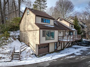 Relax on the deck with outdoor seating and enjoy the peaceful surroundings.