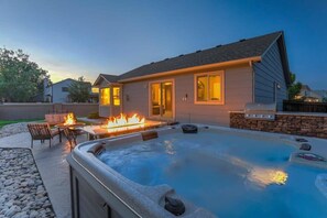 A residential property with a swimming pool, outdoor seating, and a fire feature. - Mountainside View Firepit & Hot Tub near Broadmoor (Colorado Springs)
