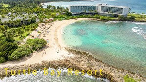 A resort with a beach, clear turquoise waters, and a large building with multiple floors. - Turtle Bay Golf Course View. Updated 1-bed w/*AC, covered lanai, end unit (Kahuku)