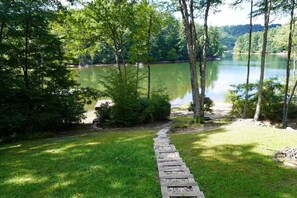 Property grounds - Lake front with private dock, fire pit, hammock, pool table & gorgeous views! Fishing poles, paddle boards & canoe provided. (Cullowhee)