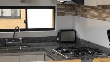 Fridge, microwave, stovetop, coffee/tea maker