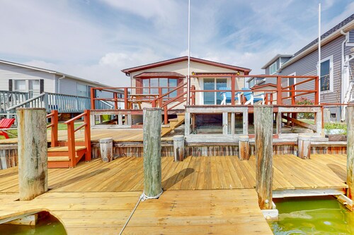 Renovated waterfront home with dock, bay access, & shared pool/tennis