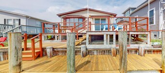 Renovated waterfront home with dock, bay access, & shared pool/tennis