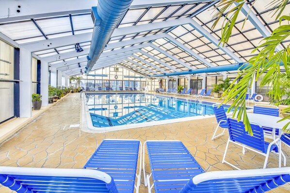Indoor pool, a heated pool - Beachfront condo with ocean views, pool, tennis, gym, game room, AC, & WiFi (Ocean City)