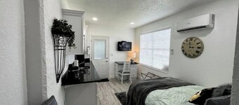 Modern studio apartment with covered outside seating area