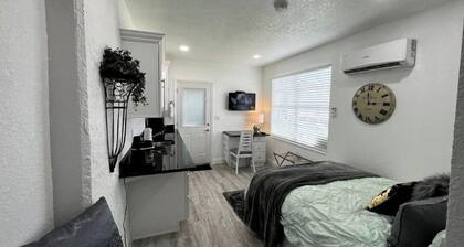 Modern studio apartment with covered outside seating area