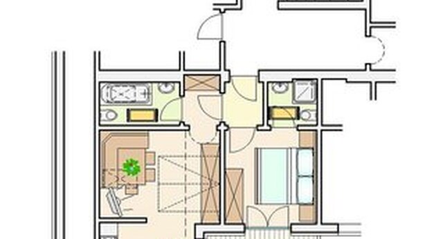 Un plan d’étage d’un hôtel comprenant un salon, une cuisine, un coin repas et deux chambres.