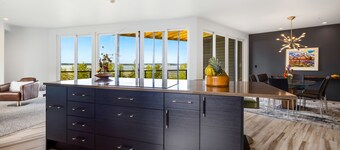 Luxury villa with inlet views, hot tub, decks, grill, balcony, fireplace, & W/D