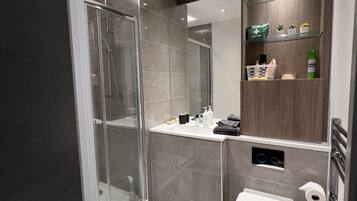 Bathtub, hair dryer, towels, soap