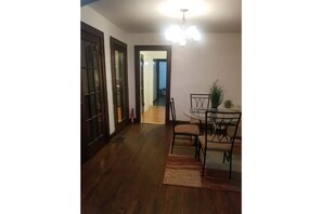 Enjoy meals in this dining area with a glass table and four chairs.