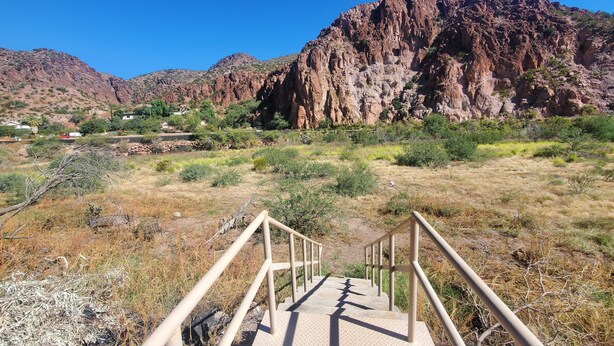 A concrete staircase leading up to a rocky mountain with a clear blue sky. - Rode Inn of Clifton (Clifton)