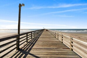 A wooden pier extending into the ocean with railings on both sides. - Ocean View 2BR • First-Floor • Cherry Grove • Sea Cabin 125-B (North Myrtle Beach)