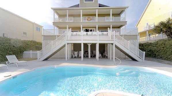 A two-story building with a pool in front. - Ocean Drive Oceanfront 6BR • All En-Suite • Private Pool • Sleeps 20 • Ibis (North Myrtle Beach)