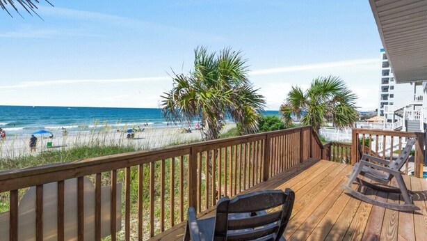 A wooden deck with a view of the beach and ocean. - Oceanfront 5BR Home • Back Deck on the Beach • Cherry Grove • Momma’s Gift (North Myrtle Beach)