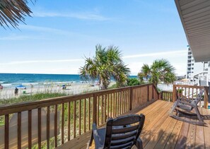 A wooden deck with a view of the beach and ocean. - Oceanfront 5BR Home • Back Deck on the Beach • Cherry Grove • Momma’s Gift (North Myrtle Beach)