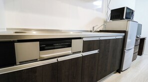 Fridge, microwave, stovetop, cookware/dishes/utensils