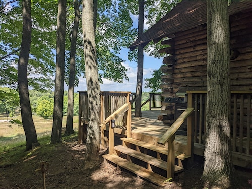 Rustic Retreat Log Cabin Nestled Among 65 Acres